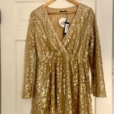 Boohoo Sequin Skater Dress, Mid-Thigh Length. Never Worn, Perfect For Party Wear! Gold Long Sleeve Dress For Winter, Gold Long Sleeve Winter Dress, Gold Long Sleeve Mini Dress For Fall, Gold Long Sleeve Mini Dress For Holiday Party, Glamorous Long Sleeve Maxi Dress For Festive Occasions, Gold Long Sleeve Maxi Dress For Fall, Fall Holiday Party Long Sleeve Dresses, Gold V-neck Mini Dress For Fall, Chic Long Sleeve Festive Dresses