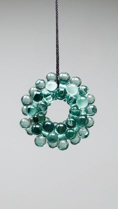 a glass ornament hanging from a string