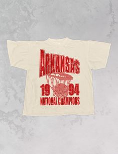 Show support for your favorite team Game Day in our Arkansas Basketball National Champions oversized vintage 90's basketball inspired tshirt!- Features the word "Arkansas" across the top in oversized lettering with a basketball hoop underneath and "1994 National Champions" underneath it all in a red ink- Screen print transfer that is heat pressed onto each tshirt- Printed on a vintage feel, garment dyed t-shirt that gets softer with each wash.- Oversized fit- Sizing translation: XS/S = L , S/M = XL , L/XL = 2XL , 2XL/3XL = 3XL- 100% Cotton**due to screens & filters color may vary from pictures** Band T Shirts Design, Cool Sports Shirts, Vintage Christian Tshirt, Vintage Basketball Shirts, Vintage Sports Shirt Design, Event Tshirt Design Shirt Ideas, Vintage Merch Design, College T Shirts Design, Athletic Shirt Design