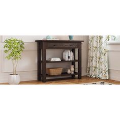 a wooden shelf with books on it next to a potted plant in a living room