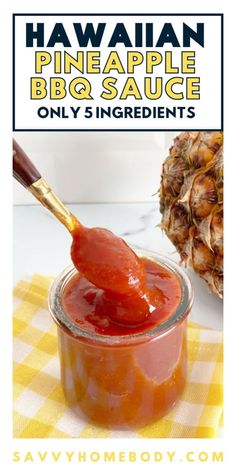 a pineapple bbq sauce in a jar with a spoon