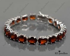 This Listing is For-: 925 Solid Silver Bracelet, Natural Oval Hessonite Garnet Bracelet, Tennis Bracelet, Gift For Her, Hessonite Garnet Jewelry, Christmas Gift PRODUCT CODE --- RJ-5418 BIRTHSTONE --- JANUARY METAL --- 925 STERLING SILVER PRODUCTS TYPE --- BRACELET STONE DIMENSION --- 9x7 MM STONE WEIGHT --- 40.55 CTS. TOTAL WEIGHT --- 22.50 GRAMS Garnet Benefits- *Garnet is an excellent gemstone to regulate blood circulation in body. ... *It has the property to reduce the chances of haemorrhage Black Spinel Bracelet, Blue Gemstone Bracelet, Solid Silver Bracelets, Tanzanite Bracelet, Garnet Birthstone, Chakra Racine, Bracelet Tennis, Tourmaline Bracelet, Hessonite Garnet