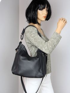 Black leather handbag with many pockets on the outside, Leather Hobo Bag, Black everyday shoulder bag. *The bag has the possibility of adjusting the short shoulder straps. *Handbag with many pockets on the outside. *The mediuml hobo bags from the new collection are very practical. The long, adjustable strap offers many carrying options: the bag can be hung diagonally across the torso, while the shorter strap can be worn freely over the shoulder or in the hand. It can also be adjusted. Dimensions Black Handheld Hobo Bag For Everyday Use, Office Black Soft Leather Hobo Bag, Black Soft Leather Hobo Handheld Bag, Black Soft Leather Handheld Hobo Bag, Black Handheld Hobo Bag For Office, Everyday Leather Bag, Large Leather Bag, Women Purse, Brown Leather Totes