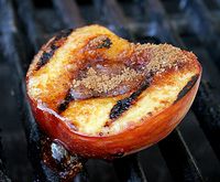 an apple is grilled on the grill with some brown stuff in it's center