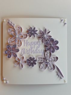 a birthday card with paper flowers on it