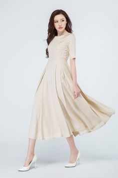 "Sweet like a spring breeze in this beige linen dress from Xiaolizi. The midi dress made from a soft linen fabric in a defined-waist construction. The summer dress topped with a scoop neckline + pleating details on the two part of the chest. The party dress finished with short sleeves + two seam pockets. DETAIL * Beige linen fabric * 50% linen , 50% cotton blend * Short sleeves * Scoop neckline * Pleated in front * Right side zipper closure * Two pockets on each side * Women's dress, party dress Wedding Dress Linen, Bible Sayings, Greek Dress, Party Dress Wedding, Choli Dress, Summer Formal Dresses, Floral Prom Dresses, Defined Waist, Linen Dress Women