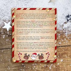 a christmas letter to santa claus on a wooden table with snow and stars around it