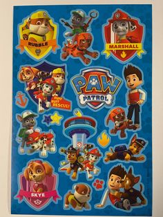 paw patrol stickers are shown on the back of a blue sheet with various characters