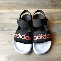 Adidas Adilette Iridescent Sport Ankle Strap Sandals. Black With Iridescent Lettering Size 8 New Without Tags Condition Vacation Coastal Beach Summer Travel Adidas Synthetic Sport Sandals For Spring, Adidas Open Toe Sport Sandals For Spring, Adidas Logo Sandals For Summer Streetwear, Spring Adidas Logo Open Toe Sandals, Adidas Open Toe Sandals With Logo, Adidas Logo Summer Streetwear Sandals, Adidas Pink Sandals With Round Toe, Adidas Sandals For Summer Streetwear, Adidas Sandals For Spring Streetwear