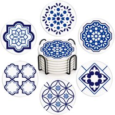 blue and white plates with designs on them