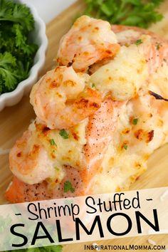 shrimp stuffed salmon on a cutting board with parsley in the background and text overlay that reads shrimp stuffed salmon