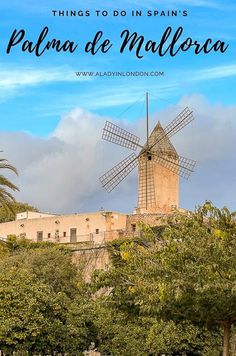 a windmill with the words things to do in spain's palm de mallorca