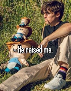 a man sitting in the grass next to a stuffed animal with words he raised me