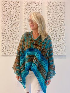 Welcome to LM Handmade Boutique! Perfect for layering in any season, more than just fashion--wearable art. Whether you're heading out for a casual day or dressing up for an evening event, this poncho adds a statement piece to your wardrobe. Limited Edition** Once it's gone, it's gone.   Get your one-of-a-kind poncho today and embrace your individuality with every wear! Step into a world where fashion meets craftsmanship. Each piece is lovingly handmade to create a truly one-of-a-kind piece.  No Handmade Bohemian Shawl Poncho, Bohemian Shawl Poncho, Bohemian Multicolor Poncho For Festival, Handmade Bohemian Long Poncho, Free Size Bohemian Poncho For Festivals, Handmade Multicolor Bohemian Kaftan, Bohemian Festival Poncho Free Size, Bohemian Blue Poncho For The Beach, Handmade Bohemian Poncho For Festival