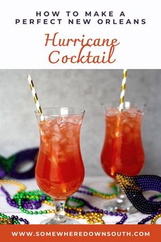 two glasses filled with red drink and garnished with mardi gras beads