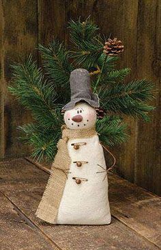 a snowman made out of burlock and twine with pine cones on top