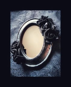 a mirror that has some flowers on it