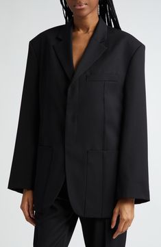 Never underestimate the statement an oversized jacket from Simon Portes Jacquemus can make. 32" length (size 42 FR) Hidden-button placket Notched lapels Chest welt pocket; front patch pockets; interior pocket Back vent Lined 53% viscose, 45% virgin wool, 2% elastane Dry clean Imported Designer Clothing Designer Long Coat Blazer With Hidden Buttons, Oversized Classic Long Blazer, Modern Oversized Blazer With Hidden Button Closure, Oversized Blazer With Buttons For Office, Modern Oversized Outerwear For Formal Occasions, Oversized Black Outerwear With Welt Pockets, Black Oversized Outerwear With Welt Pockets, Oversized Single Breasted Black Blazer, Oversized Structured Outerwear For Business