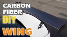 the carbon fiber wing on a car with text that reads diy wing for cars