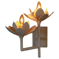 Double lotus flower sconce by Tracey Garet of Apsara Interior Design. Each 6.5" D flower holds an individual light. The fabrication is plaster over steel tubing. The design shown is in white plaster. All Apsara Designs are custom made. They can be modified to any specific shape and size. They can have any color chose for the enamel finish. Giacometti Style. We offer UL listing and labeling for most light fixtures. Burgundy Paint, Plaster Paint, Contemporary Wall Lights, Candle Sleeves, Plaster Walls, Flower Lights, Brass Candle, Modern Wall Lights, Contemporary Wall