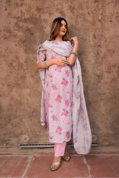 Total No of Set-3Kurta Fabric : Modal CottonWork Done on Kurta - Floral print detailingKurta Length-46 inch (calf length)Sleeves : Above elbow sleevesNeck :Round NeckColor : PinkLower type : Solid Palazzo PantsBottom Length : 38 inchLower Fabric- CottonDupatta Fabric-Modal CottonDupatta Length - 2.5 meterOccasion : Party WearWashing Instructions: Dry Clean Pomcha Jaipur, Ruffled Saree, Stand Collar Top, Top And Pants Set, Silk Lehenga, Embroidered Skirt, Indian Fashion Designers, Kurta With Pants, Kurta Set