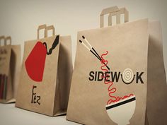 three paper bags with different designs on them