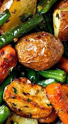 roasted potatoes, green beans and carrots on a plate