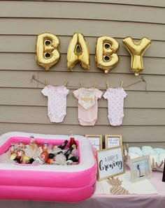 a baby shower party with balloons and decorations