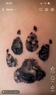 an animal's paw print on the back of a person's arm with flowers in it