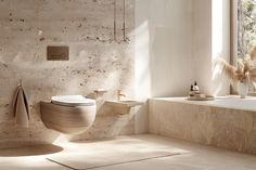 a bathroom with a toilet, sink and bathtub next to a window in it