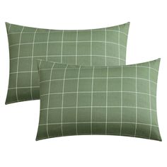 two green pillows with white squares on them