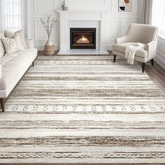 a living room with a couch, chair and fireplace