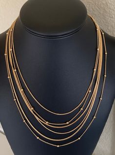 This 6 layer variegated chain layered swag necklace is 20 inches long on the shortest layer.  This is sturdy with a chain and lobster clasp.  Each chain is a different design. I specialize in finding fun wearable costume jewelry.  Please browse my shop for more options.  I box jewelry sales ready to be given as gifts. I often combine multiple item purchases to save on shipping. Please contact me if you wish to combine 3 or more items. Trendy Multi-strand Layered Chain Necklace, Multi-strand Delicate Chain Necklace For Party, Delicate Multi-strand Chain Necklace For Party, Multi-strand Double Chain Necklace, Multi-strand Metal Layered Necklace With Adjustable Chain, Multi-strand Clavicle Chain Necklace For Layering, Gold Chain Multi-strand Layered Necklace, Trendy Multi-strand Layered Necklace With Double Chain, Multi-strand Gold Chain Necklace For Layering