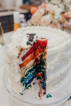 there is a cake that has been decorated with many different colors and words on it