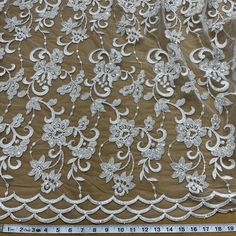 white lace with flowers on brown background