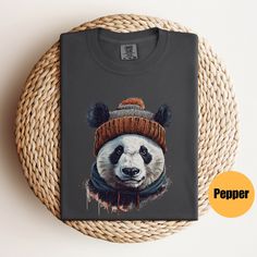 "Panda Bear Graphic Tee | Cute Panda Bear Shirt | Womens Bear Shirt | Panda Gifts | Gift For Her | Gift For Him | Unisex Graphic Tee Matching Sweatshirt: https://printworkshopcompany.etsy.com/listing/1627364646/panda-bear-sweatshirt-panda-mom-shirt ** HOW TO ORDER 1. Check our photos for sizing and color options.  2. Select your size and color from the drop-down menus.  3. In personalization box enter grand children's names 4. Click \"ADD TO CART\" to add the shirt to your cart. 5. Click \"PROCEED TO CHECKOUT\" to purchase your shirt. ** VIP Email List Be sure to join our VIP Email list for new product releases, special promotions, and giveaways! https://email.everbee.io/subscribe?shopName=PrintWorkshopCompany ** PRODUCTION TIME: 1-3 days (Usually 2 days) ** SHIPPING TIME: 2-5 days (Usuall Winter Gray Letter Print T-shirt, Black Short Sleeve T-shirt For Winter, Graphic Tee Cotton T-shirt For Winter, Gray Letter Print T-shirt For Winter, Gray Relaxed Fit T-shirt For Winter, Short Sleeve Graphic T-shirt For Winter, Winter Graphic Print T-shirt With Short Sleeves, Winter Graphic Print Short Sleeve T-shirt, Bear Graphic Tee