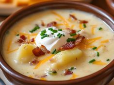 a bowl of potato soup with bacon and sour cream