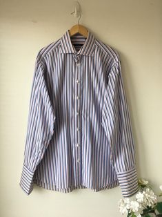 Men's Burberry London Button Down Shirt High quality, awesome shirt! Features: long sleeve, button down, front pocket, striped, amazing fabric! Material: 100% imported cotton Size: 16.5 Color: white with shades of blue and pink stripes This is a pre-owned shirt in good condition . The cuffs have been layered to stiffen so they are a shade different. Please zoom all photos Wonderful colors and super stylish! Elegant Striped Button-up Dress Shirt, Striped Cotton Dress Shirt For Semi-formal Occasions, Striped Cotton Shirt For Semi-formal Occasions, Pink Long Sleeve Dress Shirt For Business Casual, Blue Vertical Stripes Button-up Shirt, Pinstripe Button-up Office Shirt, Pinstripe Button-up Shirt For Office, Classic Striped Dress Shirt For Summer, Formal Striped Button-up Dress Shirt