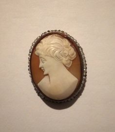 "1950s Italian cameo brooch.A tourist piece think of\"Roman Holiday\"1 3/4 inches long by 1 inch.Also has a loop that means it can be worn as a necklace.Its set in brass and surrounded with seed glass beads." Antique Cameo Medallion Brooch, Antique Cameo Medallion Brooches, Antique Cameo Brooch Collectible, Antique Cameo Brooches Collectible, Vintage Cameo Brooches For Vintage Events, Retro Cameo Jewelry For Formal Occasions, Formal Retro Cameo Jewelry, Roman Holiday, Silver Horse