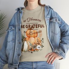 Celebrate the beauty of autumn and the spirit of gratitude with our Fall Harvest Gratitude Tee. This tee is not just a piece of clothing; it's a reminder to be thankful, be grateful, and feel blessed for all the joys in life. As the leaves turn brilliant shades of red, orange, and gold, this tee captures the essence of the season. The cozy and comfortable fabric is perfect for crisp fall days, and the elegant typography adds a touch of sophistication to your attire. Whether you're gathering around the table with loved ones or taking a leisurely stroll through a scenic fall landscape, the Fall Harvest Gratitude Tee is the perfect companion. Wear it proudly and share the message of gratitude with the world. Embrace the warmth and beauty of fall while spreading positivity with this meaningful Inspirational Crew Neck T-shirt For Fall, Inspirational Graphic Print T-shirt For Fall, Inspirational Cotton T-shirt For Fall, Elegant Typography, Appreciate Life, Orange And Gold, Be Thankful, Be Grateful, Fall Harvest