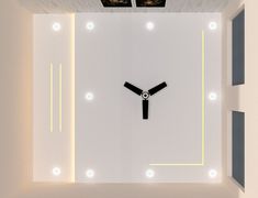 a clock is shown in the middle of a room with lights on either side of it