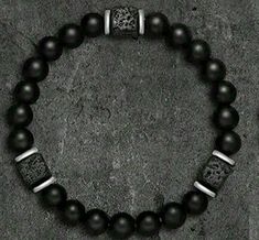 Elevate your style and well-being with our Black Obsidian Bracelet, meticulously crafted for men seeking both elegance and tranquility. This striking wristband features volcanic beads known for their grounding properties, perfectly paired with the powerful Black Obsidian stones, renowned for their ability to release negative emotions and promote overall body relaxation. Obsidian Bracelet Men, Black Obsidian Bracelet, Black Obsidian Stone, Obsidian Bracelet, Obsidian Stone, Gift For Father, Bracelet Men, Black Obsidian, Jewelry To Make