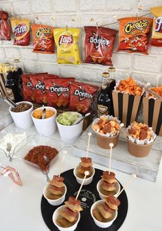 an assortment of snacks are displayed on a table