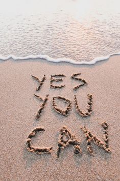 the words yes and no are written in the sand