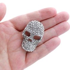 Dazzling crystal skull brooch jewelry, which can be used for your DIY project - Halloween wedding, brooch bouquet, ring pillow, invitations, cake and frame decorations, event decor, crafts, dress accessory decoration, scrap booking, jewelry gift and much more!  Size: 1 1/2 inch high 14 inches wide Stone color: Crystal clear Metal: Silver plated This rhinestone silver skull broach can be ordered with pin in the back to wire into brooch bouquet, add to wedding gown or dress sash, or any number of other craft projects or without the pin as a flat back embellishment for your sew-on, glue-on DIY project. More SILVER brooches - https://www.etsy.com/shop/Crystalitzy?section_id=16136267 Please note that this crystal rhinestone embellishment has flat backing, it is suitable only for your sew-on or Halloween Wedding Jewelry, Skull Brooch, Bouquet Ring, Rhinestone Skull, Goth Halloween, Silver Brooch Pin, Diy Halloween Projects, Dress Sash, Brooch Bouquet