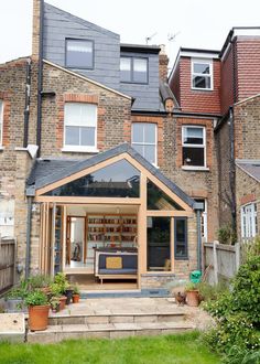 an outside view of a house with lots of windows