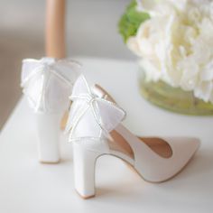 So many of you have been asking for pretty wedding shoes with block heels... Meet Valentina! Made with the finest ivory satin, Valentina is perfect for modern brides! Made with the finest ivory satin with pretty bow with jewel details! These wedding shoes are perfect for outdoor and garden weddings where you won't be worried about heels getting stuck!!! Bridal Shoes Block High Heel with removable ankle strap Style “Valentina” in ivory 3.5" heel Bridal Shoes with bow and jewel details Adjustable Gold Bridesmaid Shoes, Silver Bridesmaid Shoes, Comfortable Wedding Heels, Wedding Shoes Block Heel, Embellished Wedding Shoes, Mother Of The Bride Shoes, Bridesmaids Shoes, Shoes For Bride, Gold Wedding Shoes