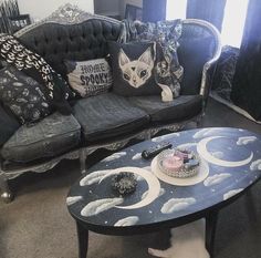 a living room with two couches and a coffee table in the middle of it