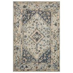 a blue and beige rug with an ornate design on the bottom, in front of a white background