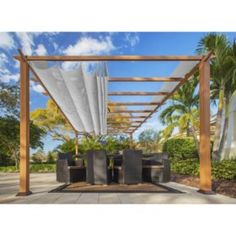 an outdoor dining area with tables and chairs under a pergolated canopy on a sunny day